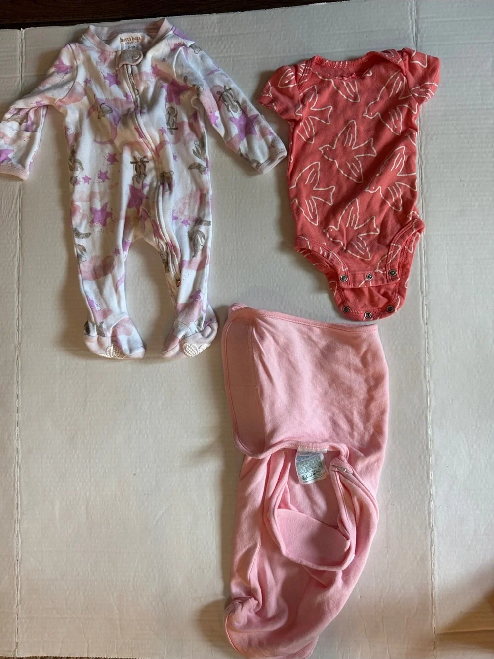 Aden & Anais Sleep sack, Burt’s Bees Footed sleeper, Carter’s onesie